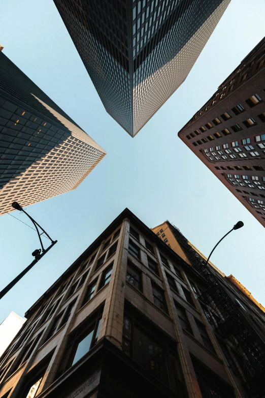 looking up at tall buildings from the bottom