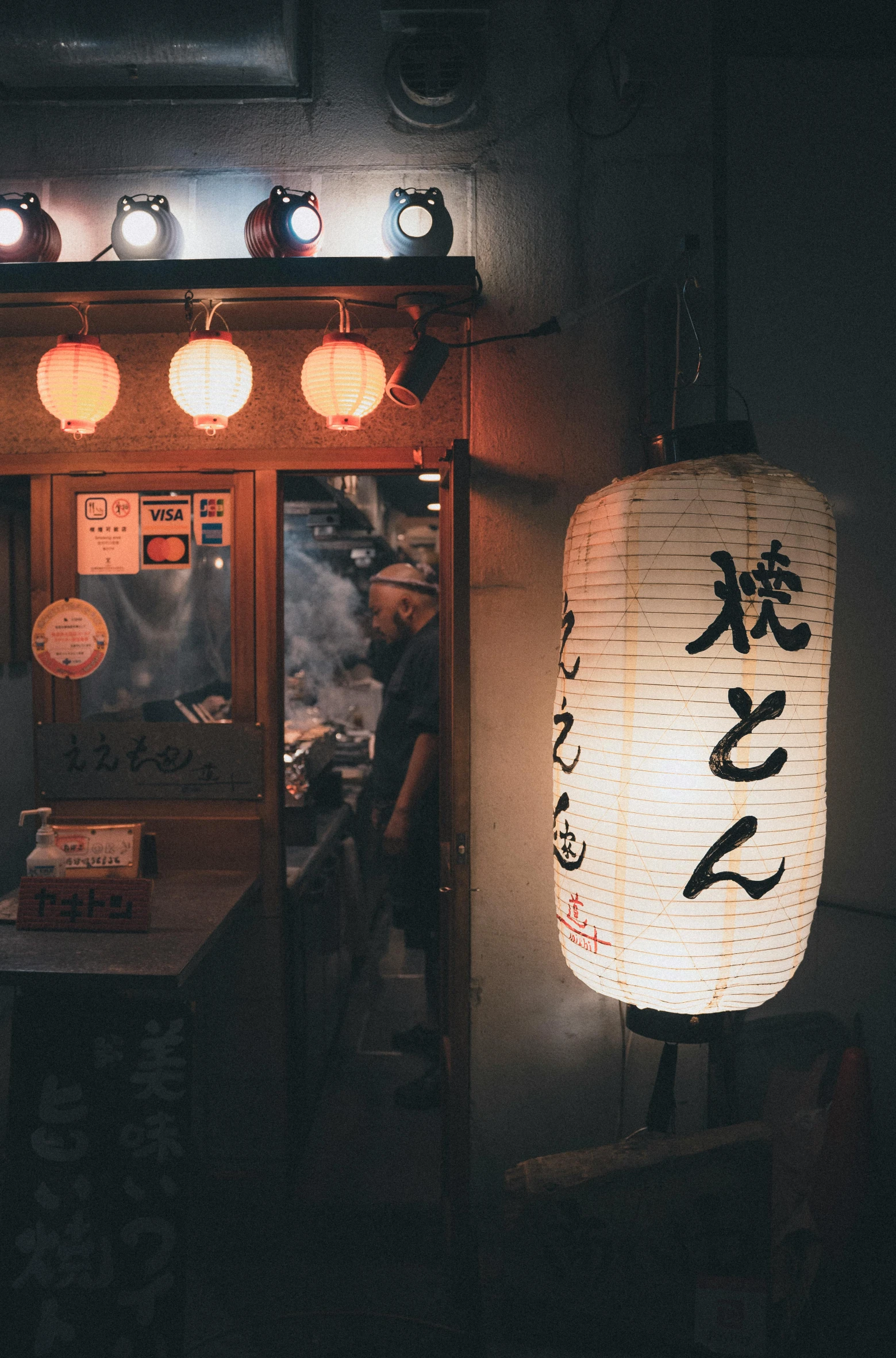 the asian lanterns have oriental writing and lights on them