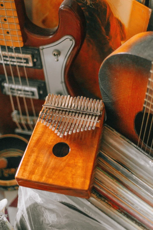 several musical instruments sitting on a table in a room