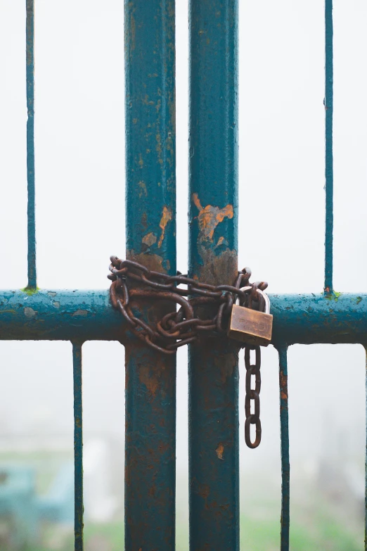 a padlock with two keys attached to it