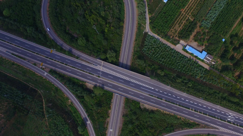 two different roads on the same direction as it passes through a forest