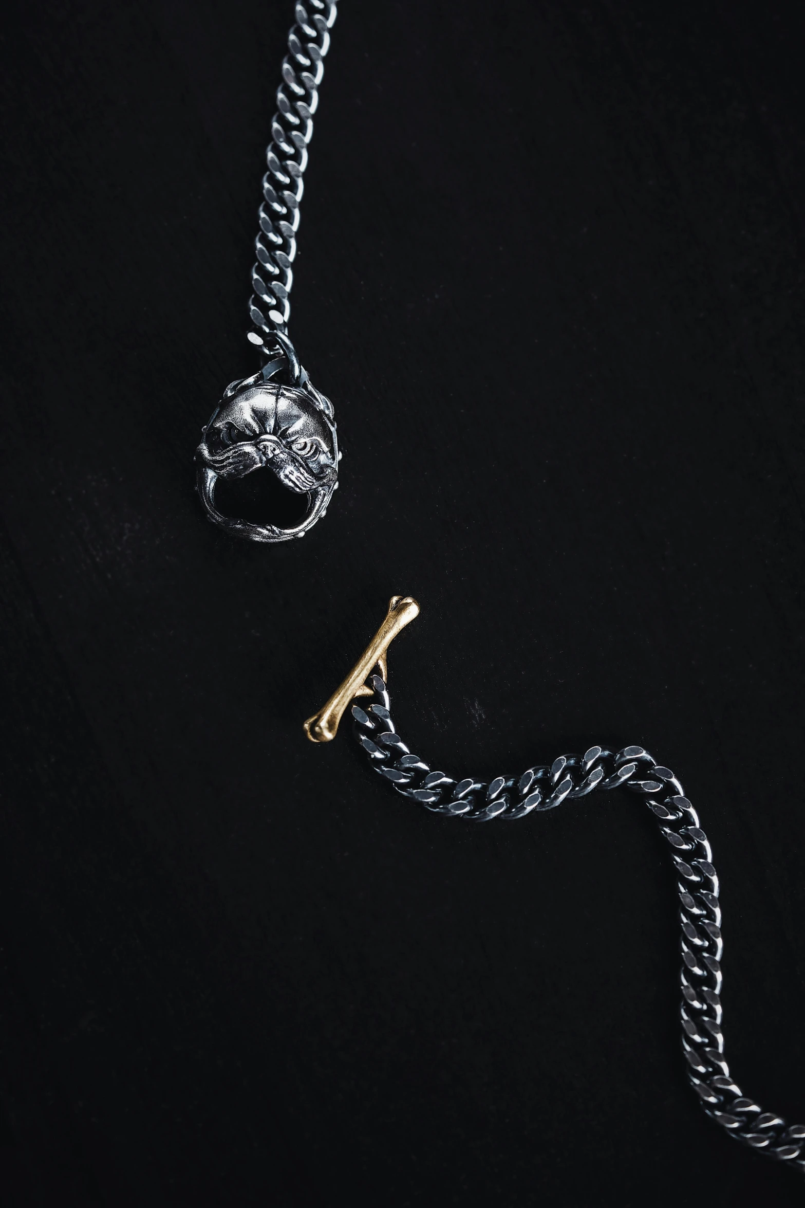 silver and gold chain with an adjustable clasp