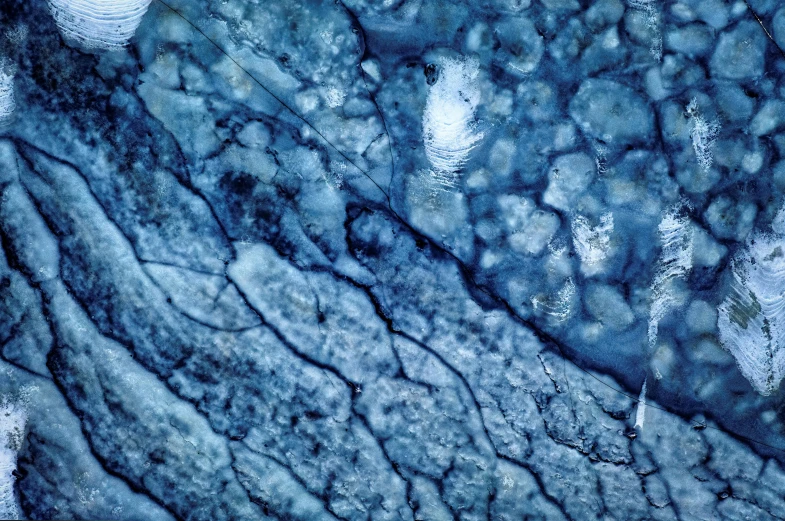 blue ice patterns created by flowing water