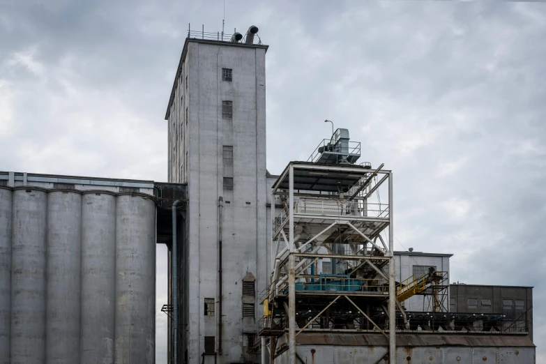 a large industrial building with a sky background