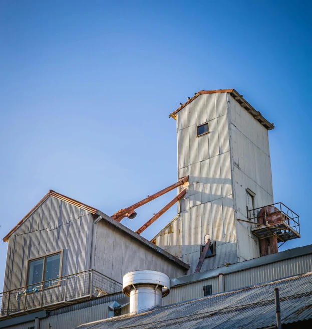 the grain elevator has moved across the industrial building