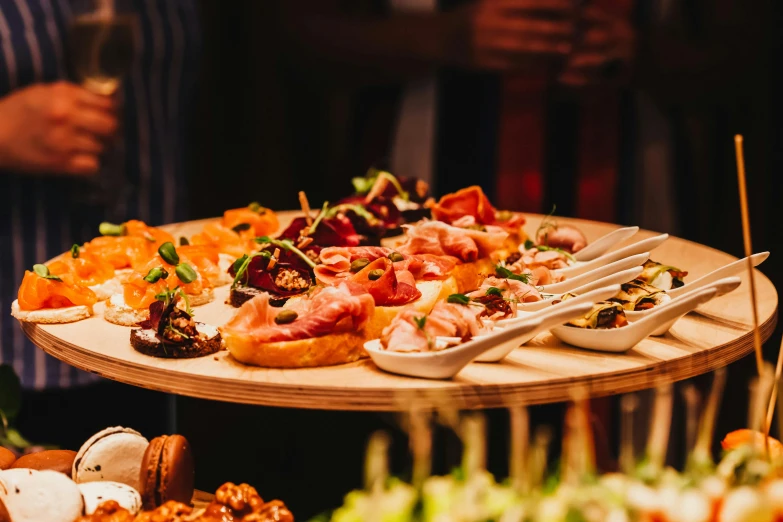 an array of different types of food on two separate serving trays