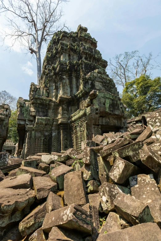 a very large stone building with lots of trees