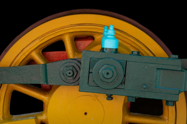 the wheels on a machine with blue cap and yellow plastic spokes