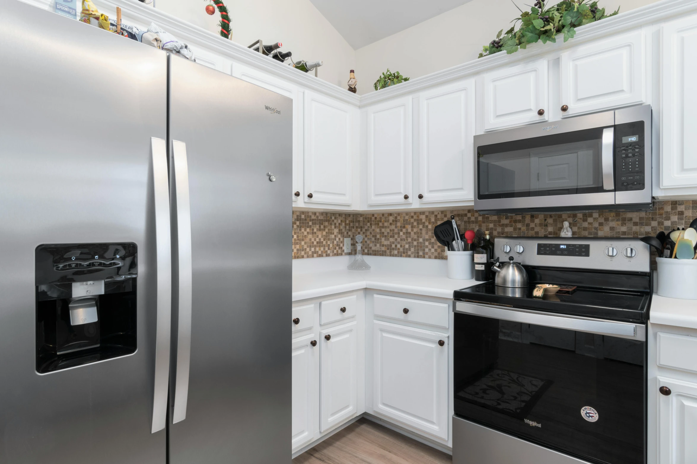 a po of some kitchen appliances in the middle of a room