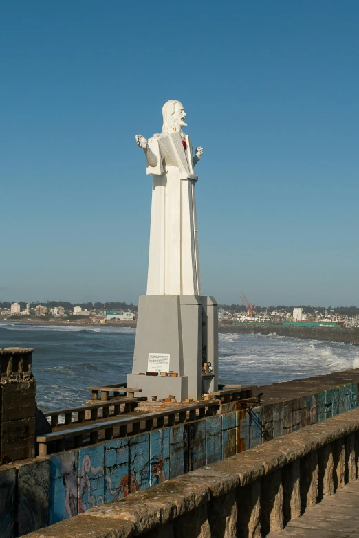 a sculpture near the ocean in a park