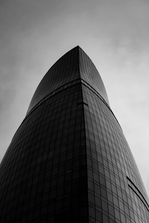 the corner of a tall building against the sky