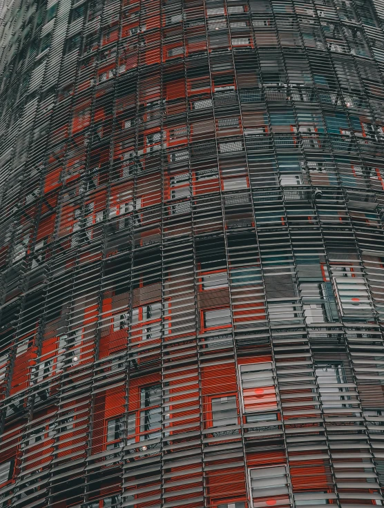 the top of a building has red and grey stripes