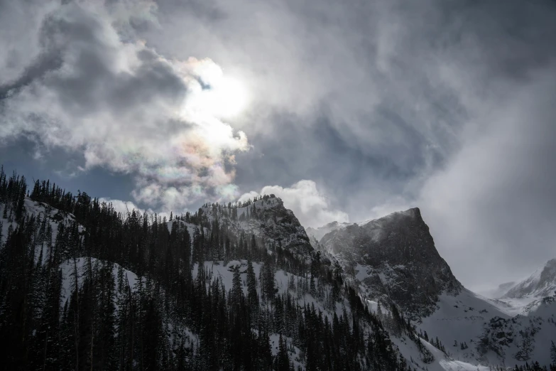 a big tall mountain with some clouds