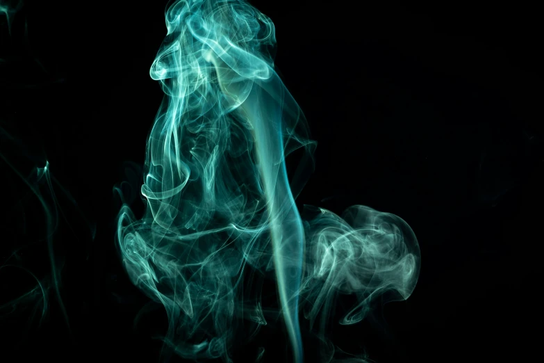 a smoke is moving across the dark background