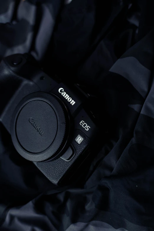 canon camera sitting on a dark background
