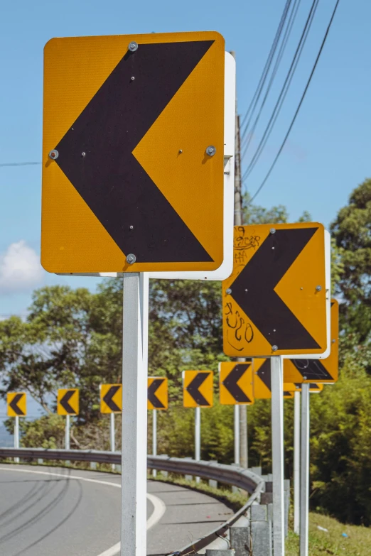 two road signs with a arrow pointing in different directions