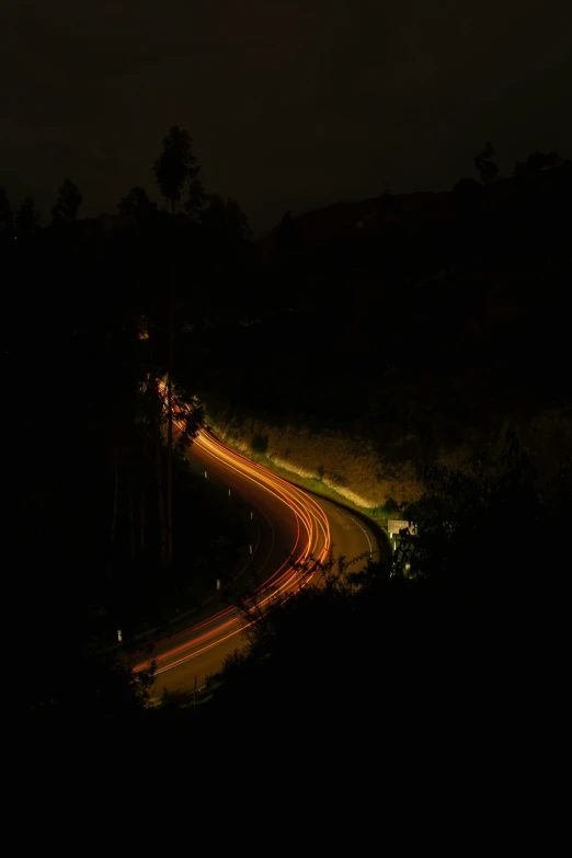 car light trails on the road at night time