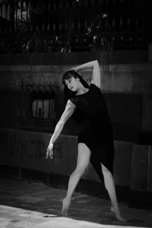 a woman stretching with her arms behind her head