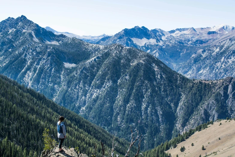 the hiker is on the top of the mountain