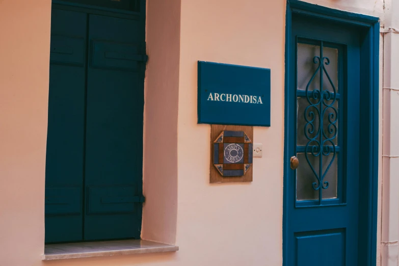 the door of an antique building with a blue window