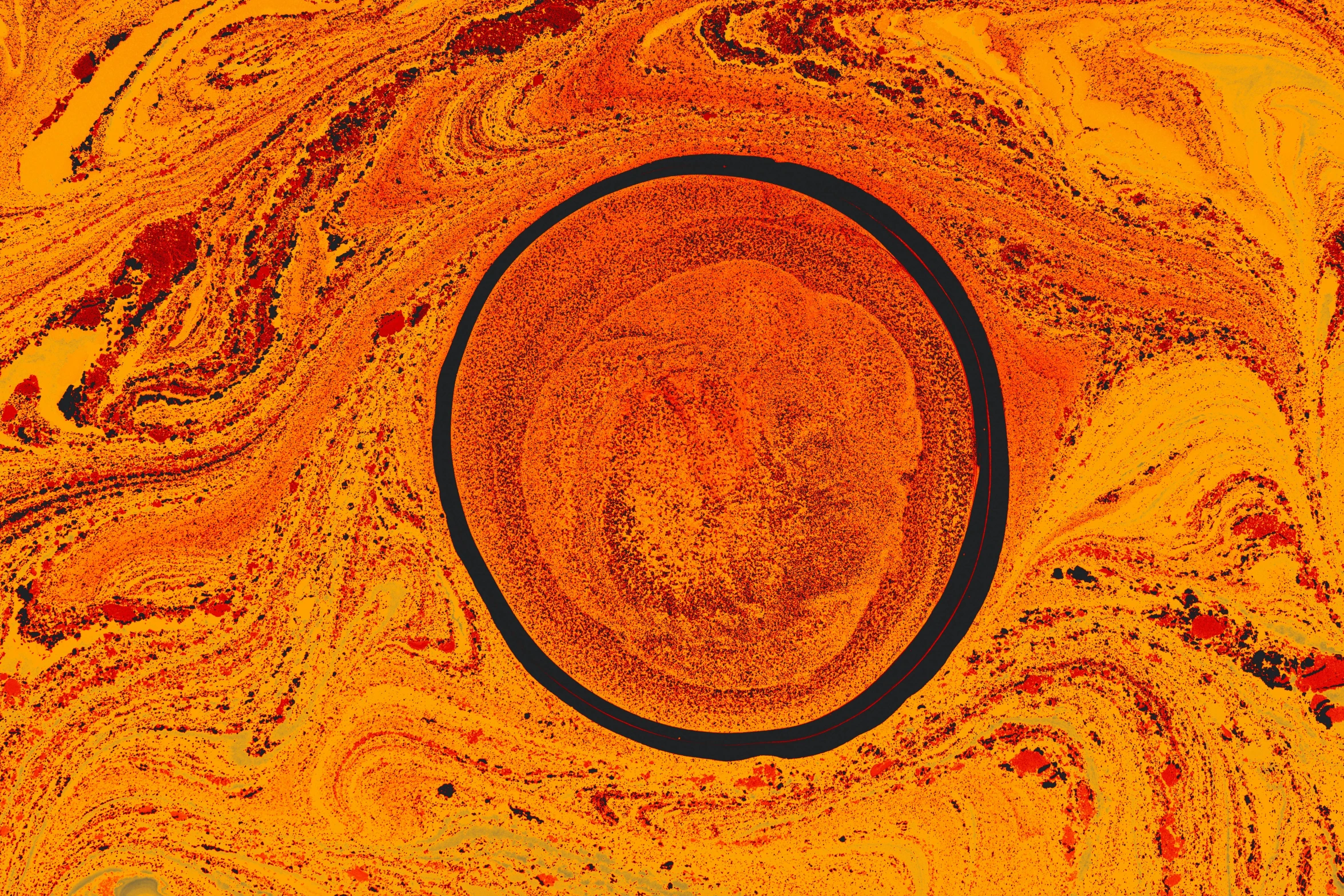 orange and black image with small circle in middle