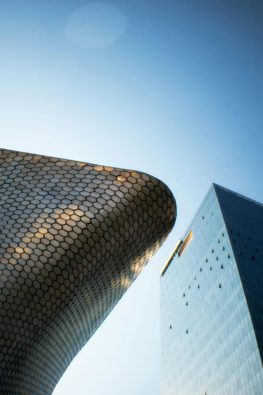 the top of a building against a blue sky