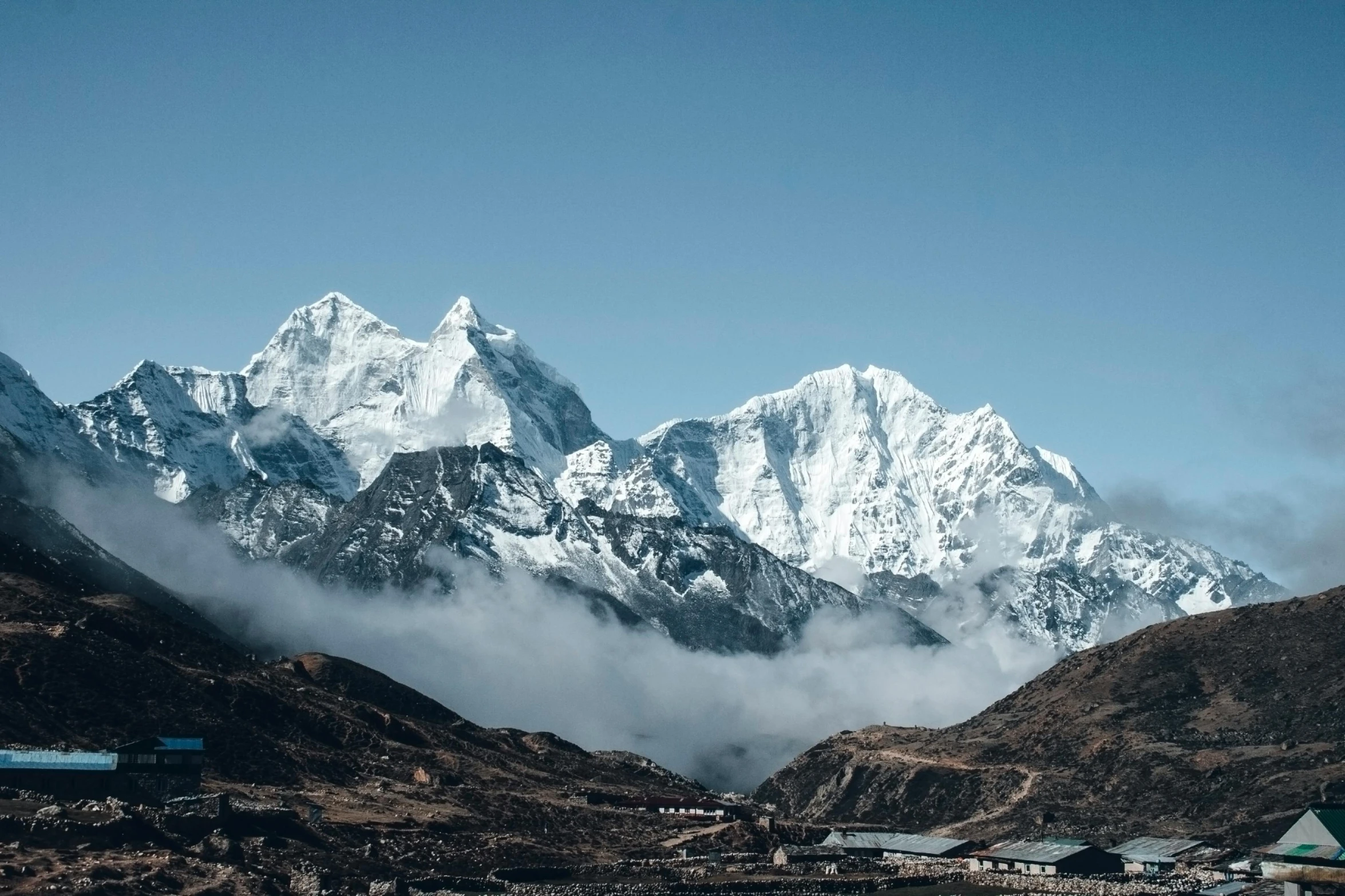 mountains covered in snow on a sunny day