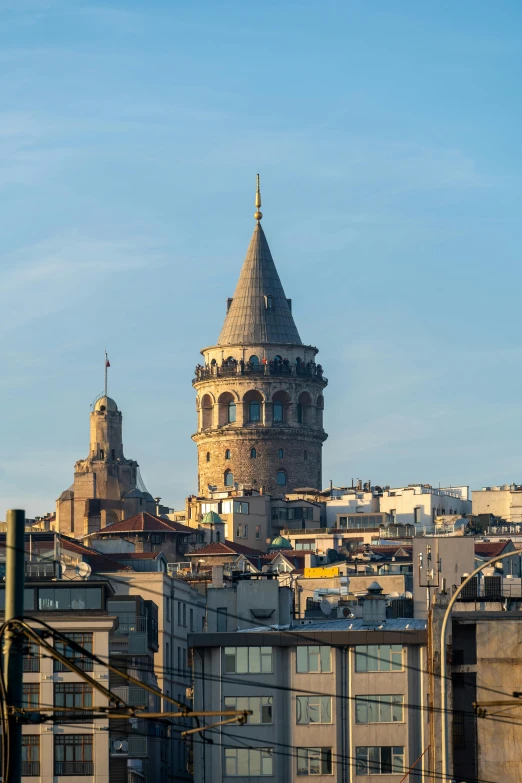 a picture of a tall clock tower over a city