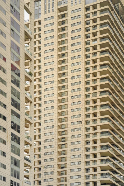 three building with windows and balconies in the middle