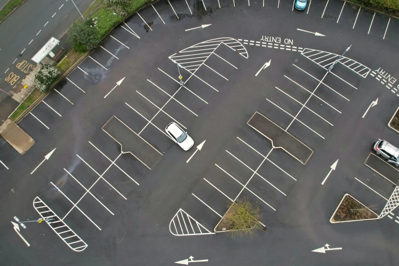 an overhead view of parking spaces and street signs