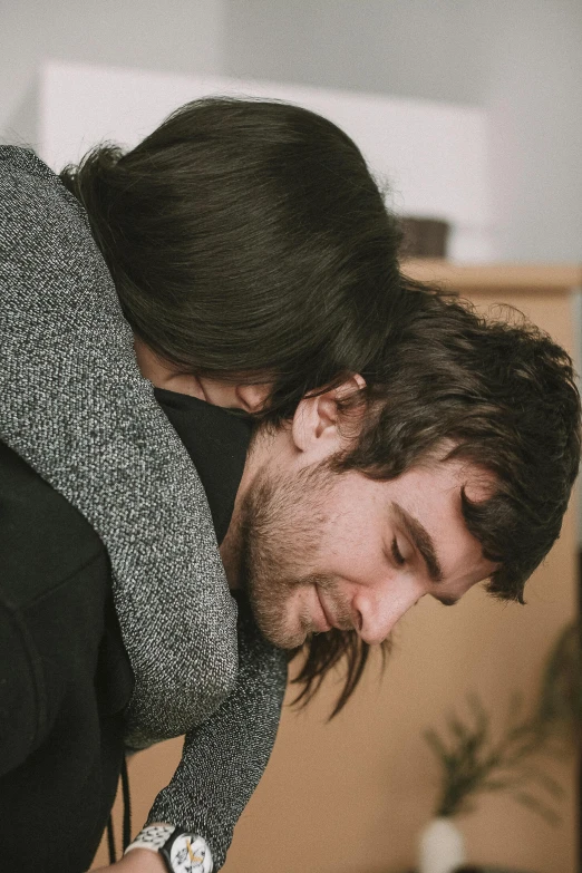 the young man is asleep on his arm