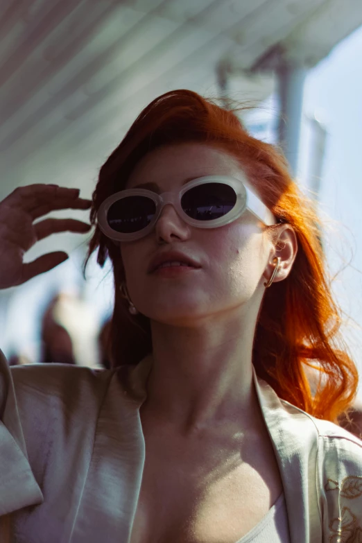 a woman wearing sunglasses on her face
