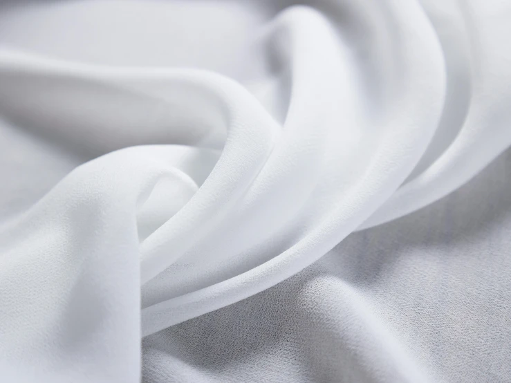 a white, soft fabric with an uneven effect