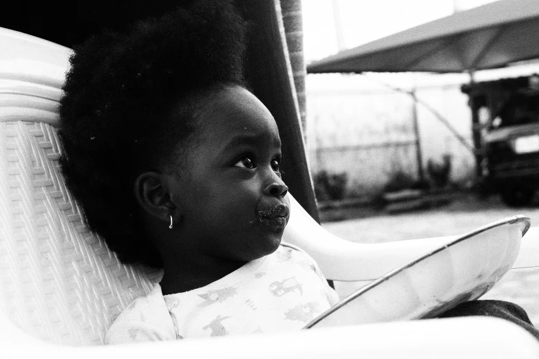 black and white pograph of a baby reading