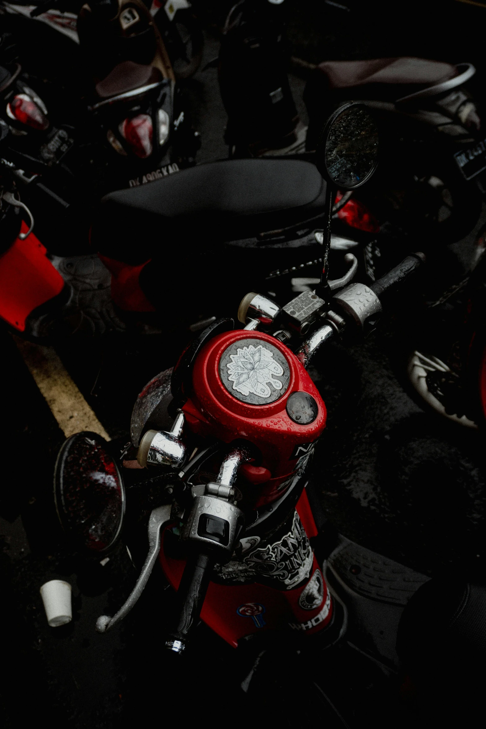 a red motorcycle with black leather seats and back lights