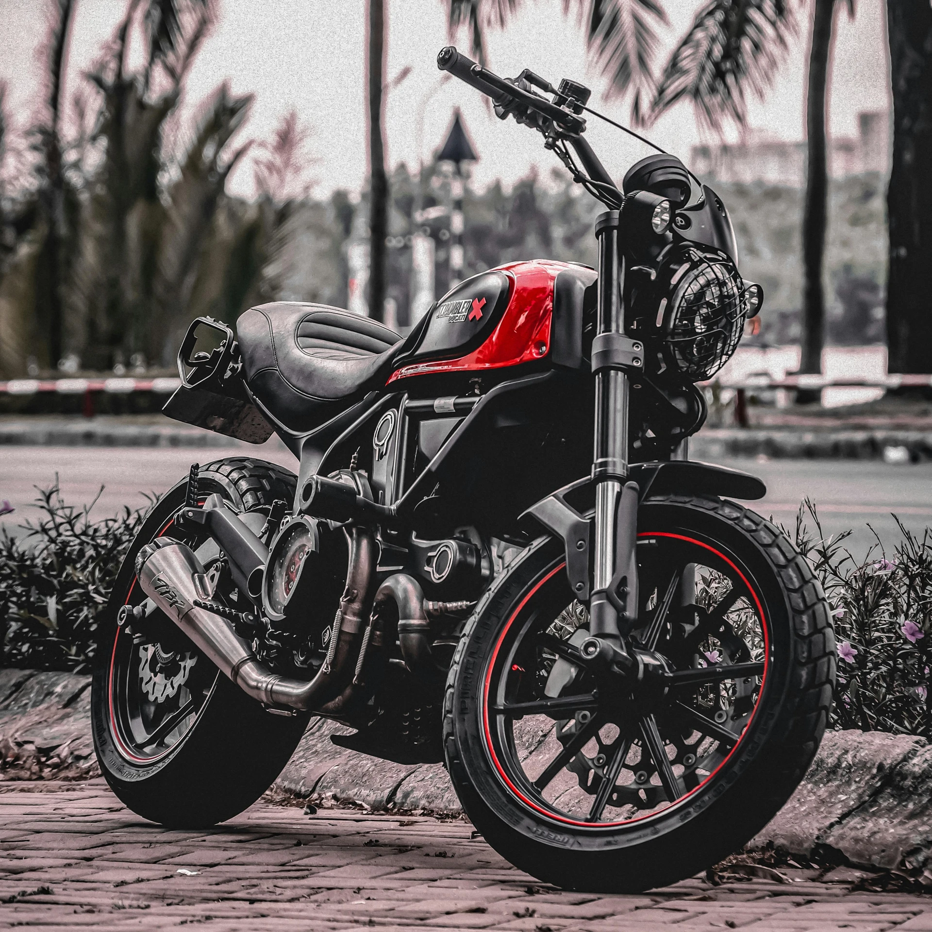 two red and black motorcycles are parked next to each other