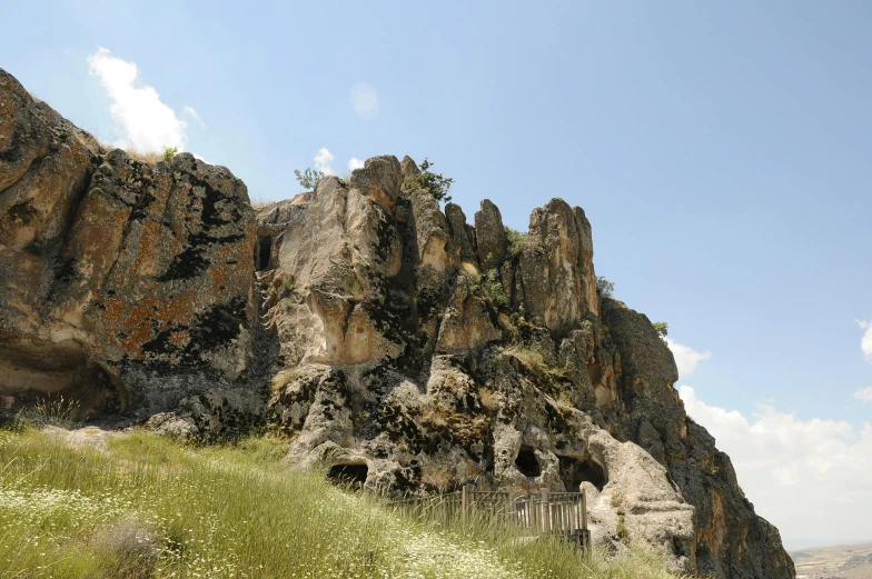 there is a huge rocky area on the cliff with many rocks