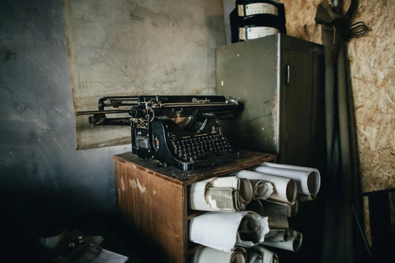an old fashioned typewriter is on a table in a room