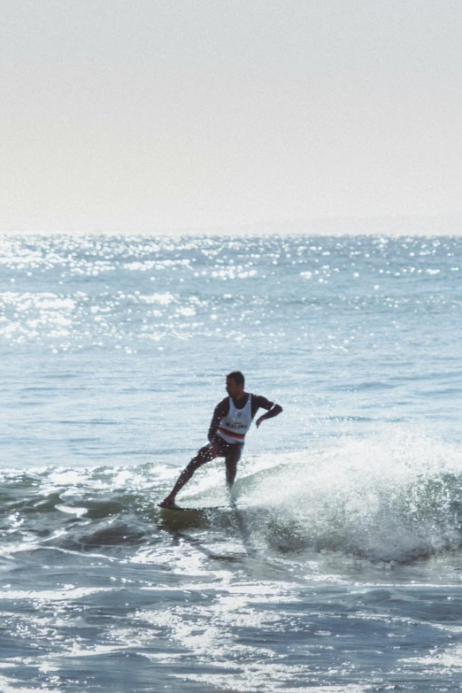 man riding a wave on a surfboard in the ocean