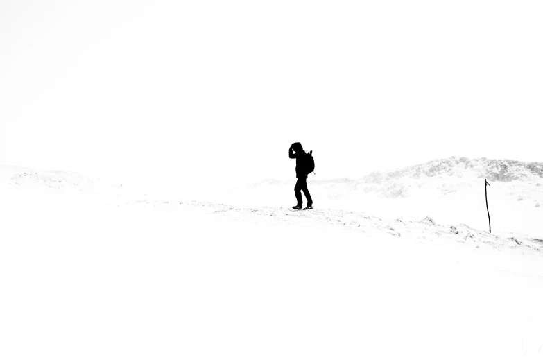 a person skiing in the snow on a mountain