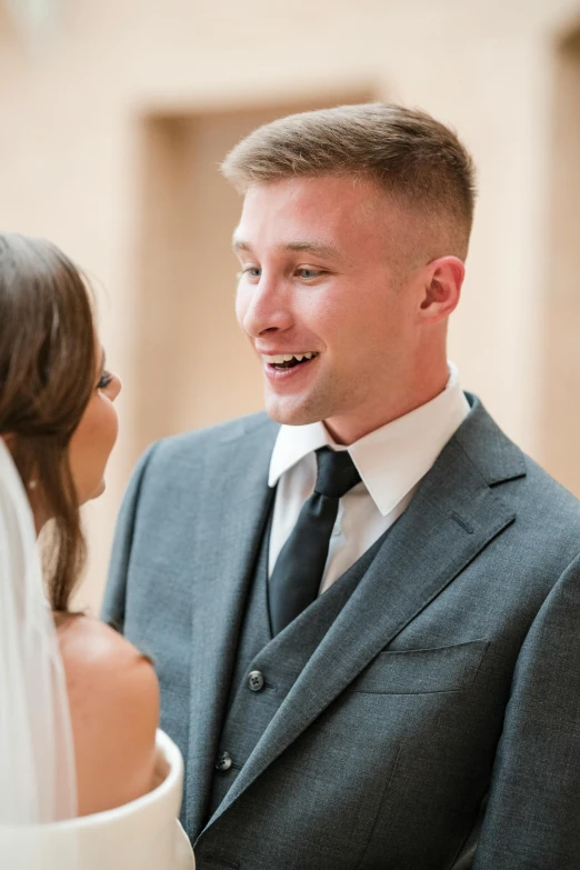 the bride looks at the groom