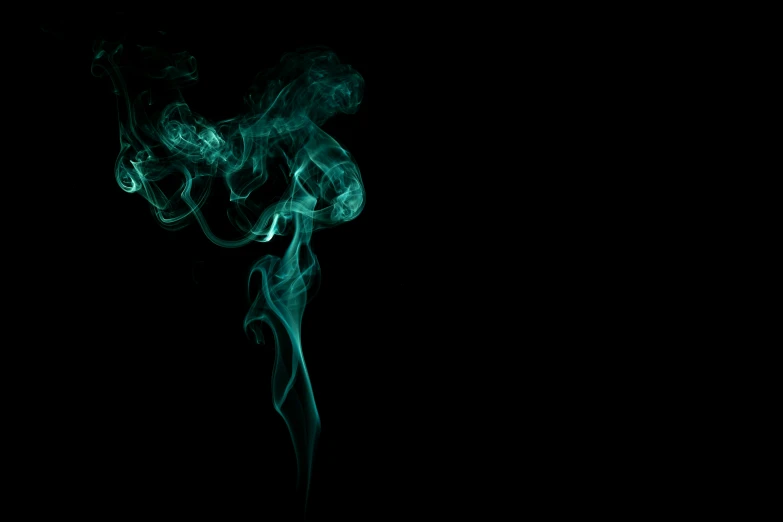 a long, smoke - like substance, on a black background