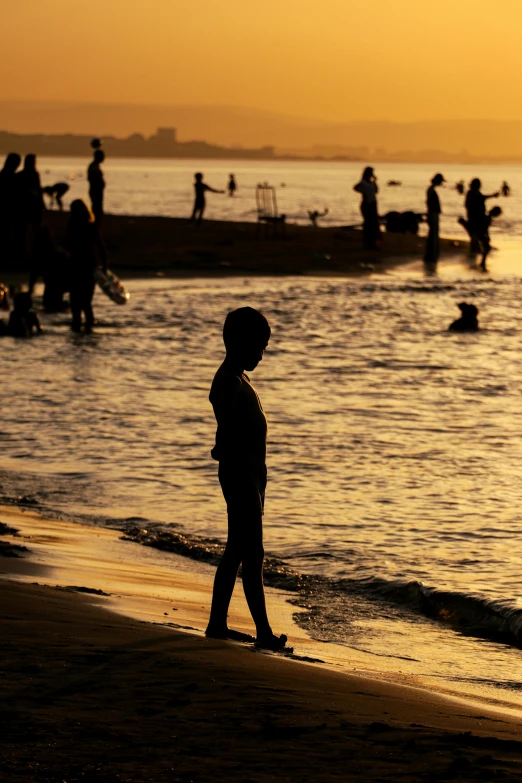 the silhouette of a child in a beach area