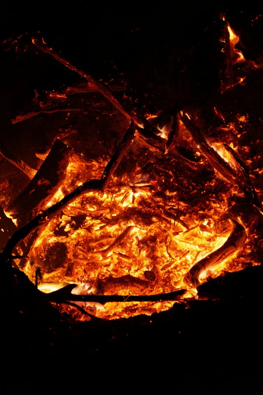 a lit up fire in a black area