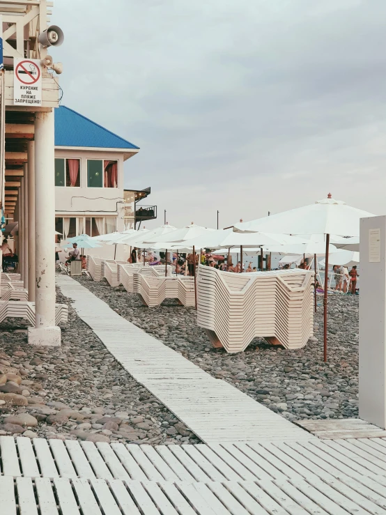 outdoor seating area near the beach with umbrellas