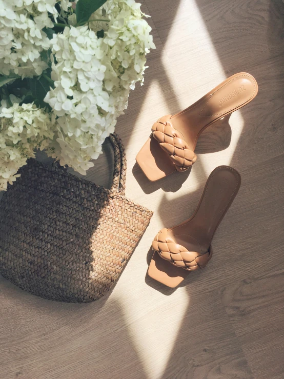 shoes, bag and hydrangeas on the ground