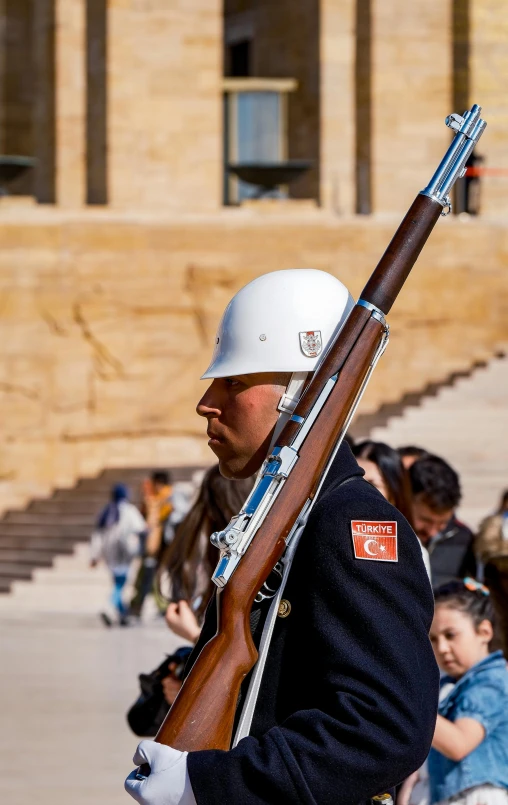 an image of a man holding a rifle