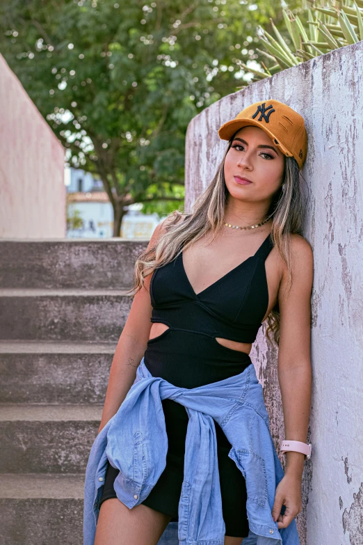 a woman posing next to some steps