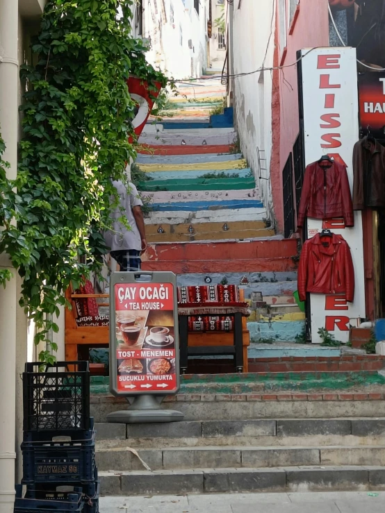 a bunch of colorful stairs with advertits on them