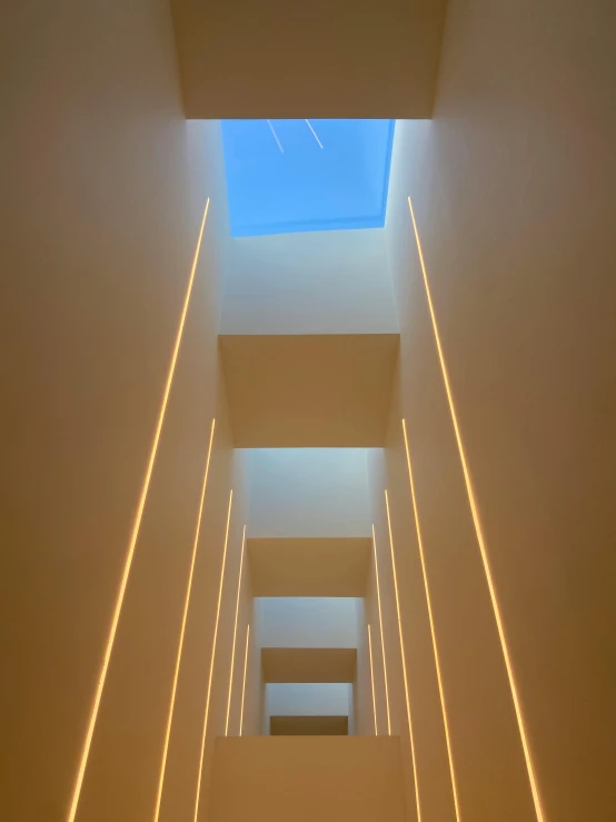 a long narrow hallway with a skylight overhead